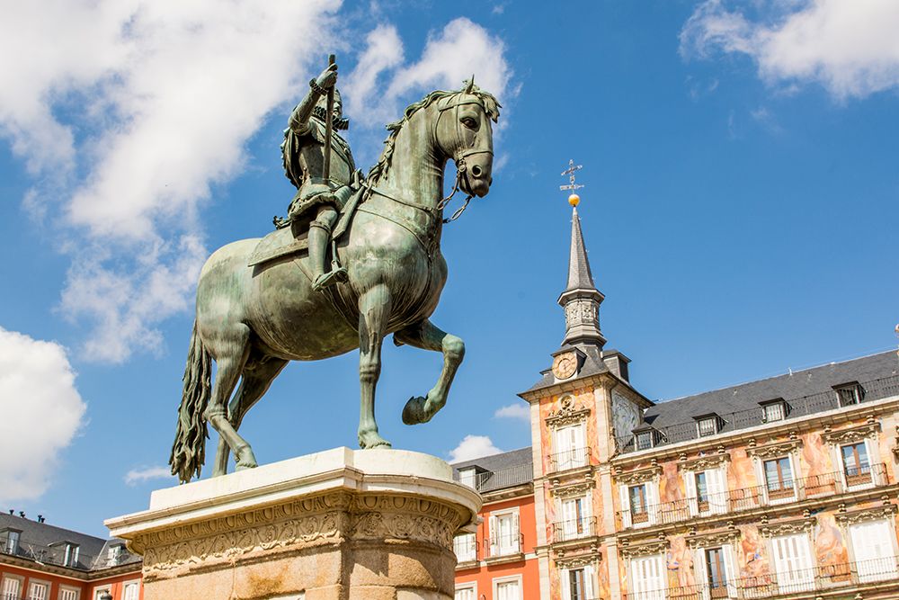 Philip III statue in Plaza Mayor and Casa de la Panaderia, Madrid, Spain.